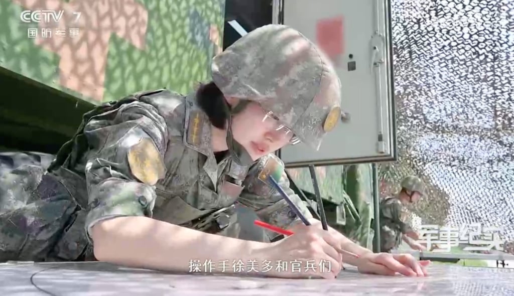 Captain Xu Meiduo has mastered abacus calculation techniques and traditional tools, such as paper, pen and ruler, as part of China’s strategic push to blend ancient methods with modern warfare tactics. Photo: CCTV