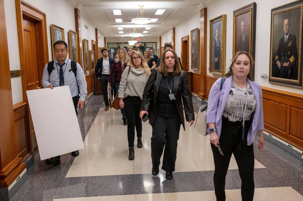Members of the press leaving the Pentagon. Photo: AP