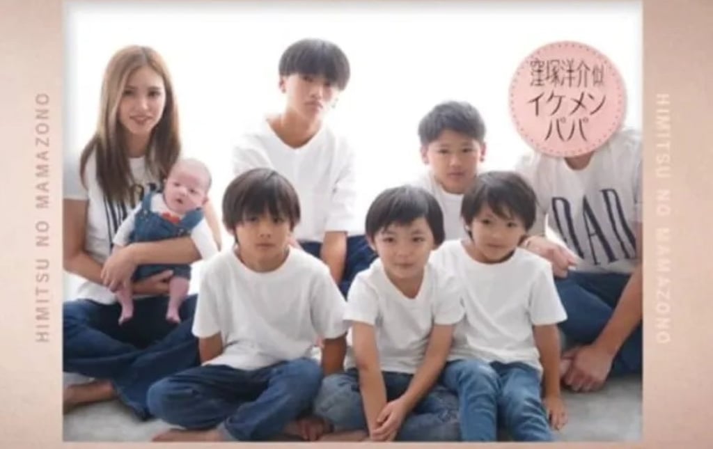 Mother Monko, far left, poses for a group photo with her six “handsome” sons. Photo: SCMPOST