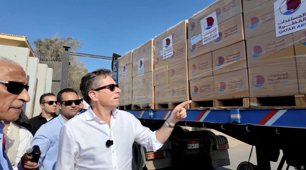 United Nations’ aid chief Tom Fletcher points at a truck loaded with humanitarian aid as it is on its way to Gaza at Rafah Crossing at the Egypt-Gaza border, in Rafah, Egypt, on Thursday. Photo: OCHA/Handout via Reuters