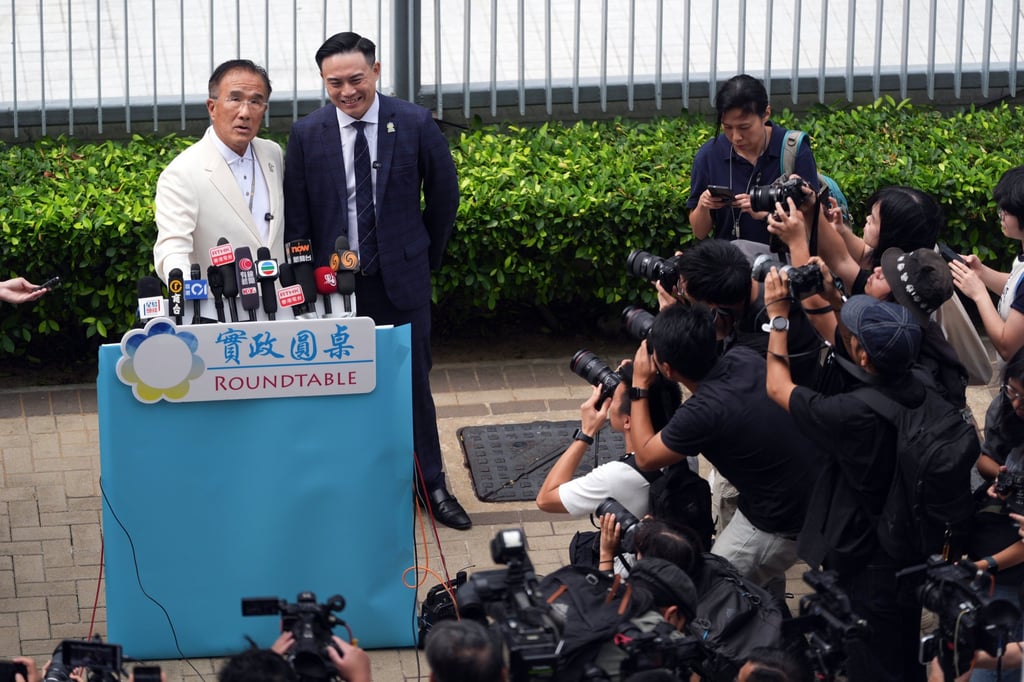 Michael Tien (left) with his Roundtable colleague Mark Chong, who has announced he will run in the coming Legco election. Photo: Eugene Lee