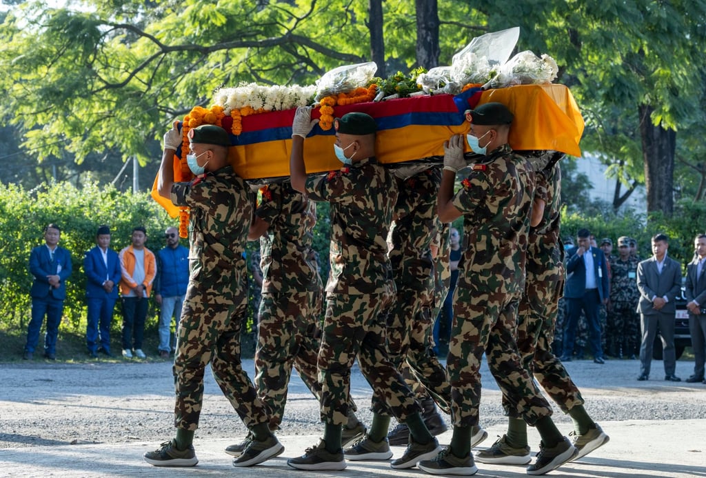 Nepalese army officers carry the coffin of late Nepalese hostage Bipin Joshi during a memorial ceremony procession on Monday. Photo: EPA