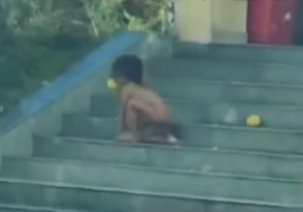 Social media users expressed shock upon witnessing the boy behaving like a dog, picking up food from the ground with his mouth and sniffing it before eating. Photo: Douyin