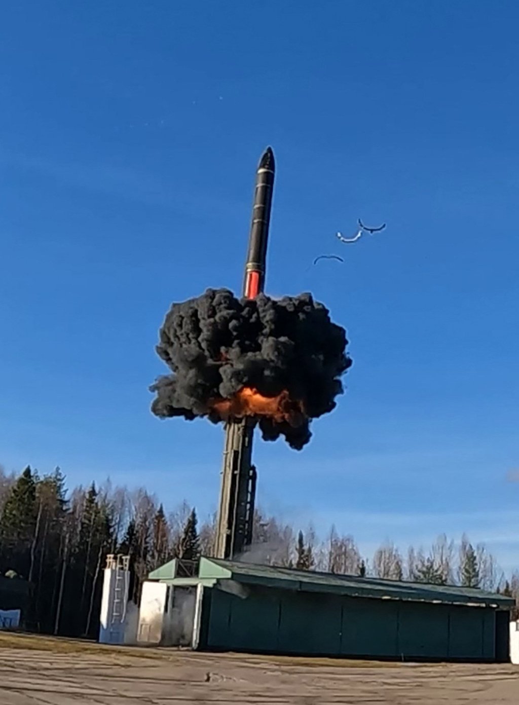 This grab from handout footage released by the Russian Defence Ministry press service on October 22 shows the launch of a Yars intercontinental ballistic missile at Plesetsk testing field in northern Russia during drills of the country’s nuclear forces.