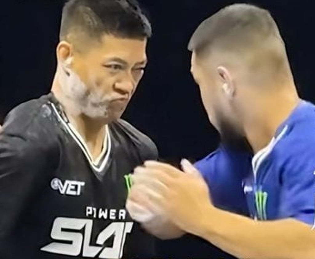 Online celebrity and martial arts exponent Zhao braces for a slap from his Kazakh opponent. Photo: YouTube/China Power