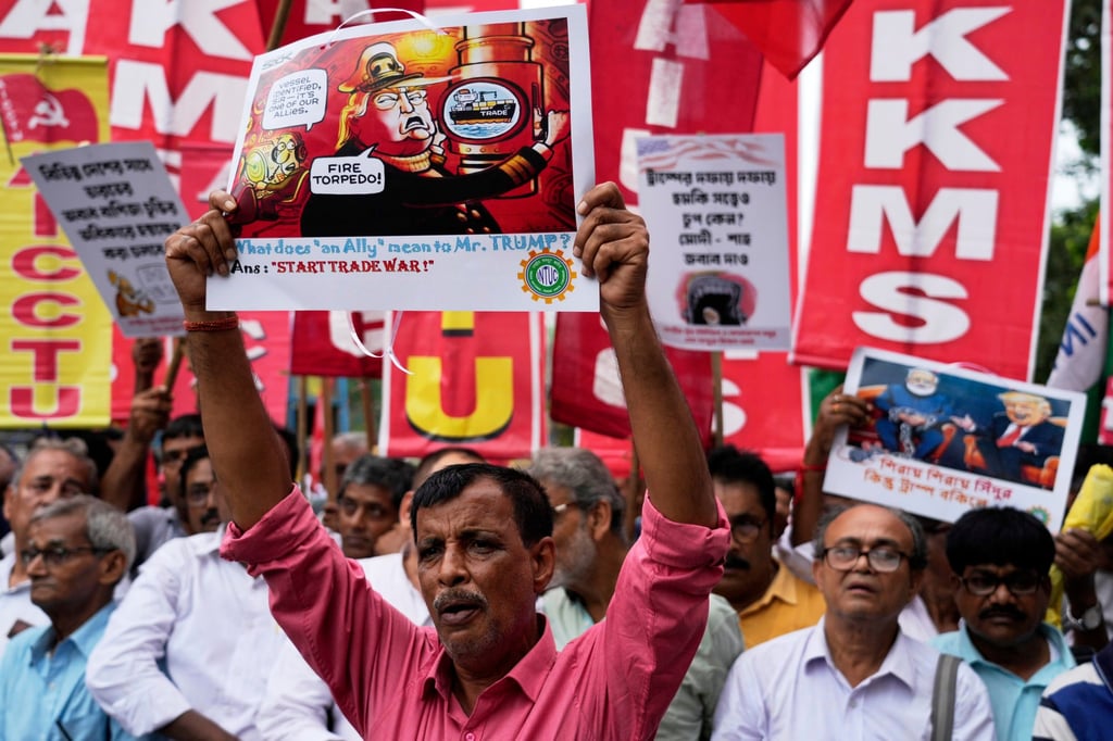 Activists of different trade unions and farmer’s organizations walk towards the US consulate in a protest rally against the US-imposed trade tariffs and the war in Gaza, in Kolkata on August 13. Photo: AP