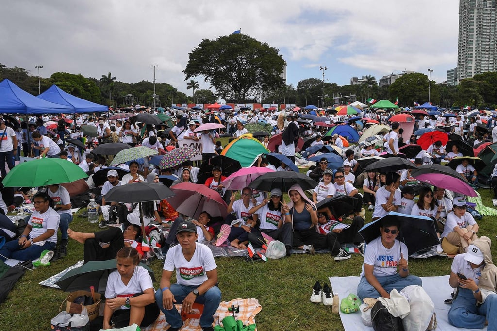 People take part in an anti-corruption protest in Manila on Sunday. Photo: AFP