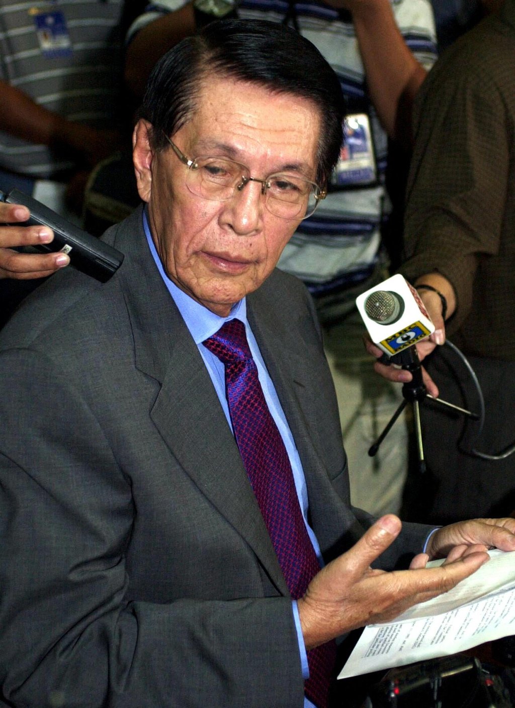 Senator Juan Ponce Enrile holding a press conference in 2000. Photo: AFP