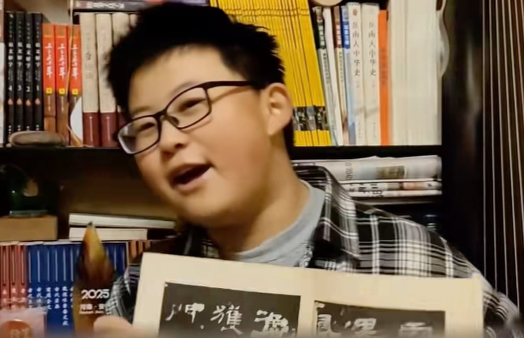 Xie Zhaoyutong shows off a favourite book in his artefact-packed bedroom. Photo: Douyin