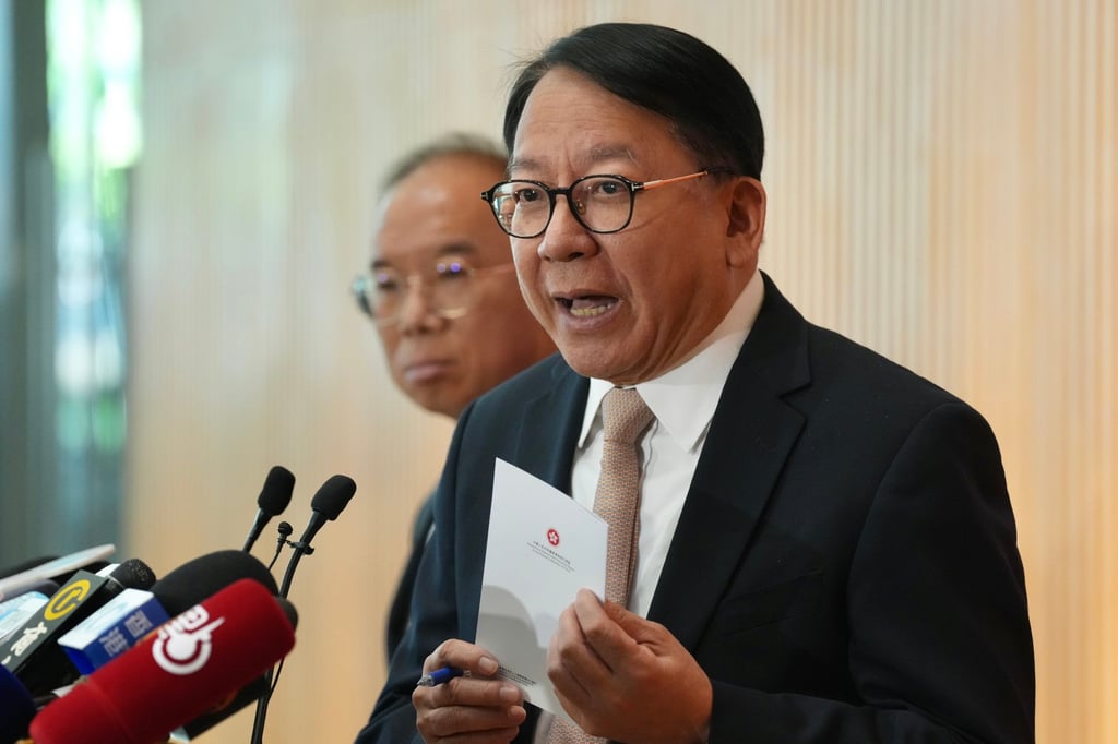 Eric Chan (right) and Erick Tsang Kwok-wai, secretary for constitutional and mainland affairs. Photo: Karma Lo