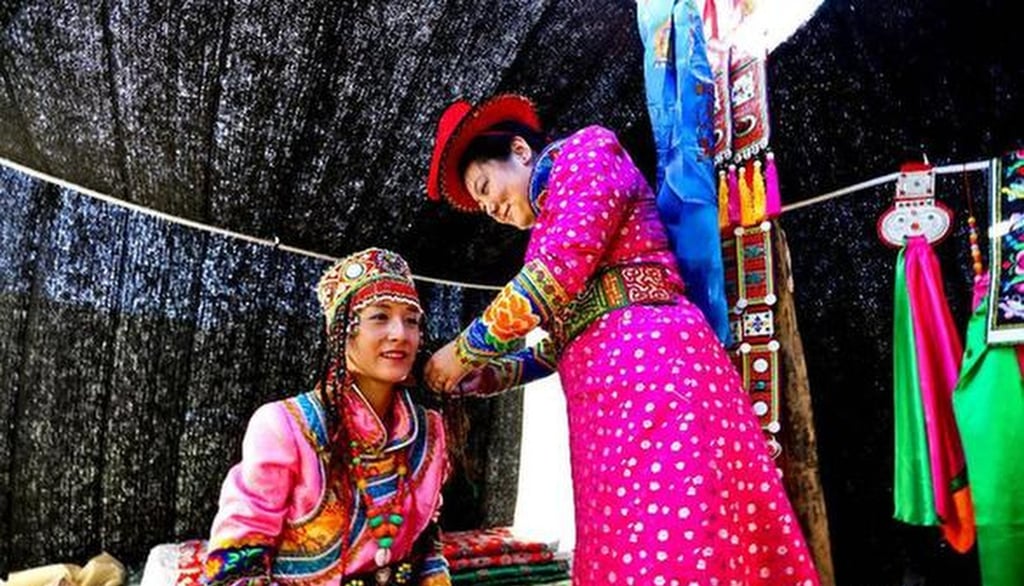 The nuptials also involve the groom dressing up in clothes provided by the bride’s family. Photo: Xinhua