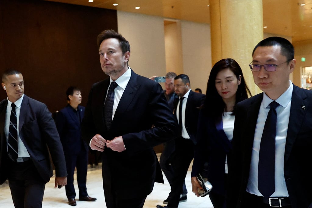 Elon Musk is seen with vice-president Grace Tao and senior vice-president Tom Zhu in Beijing on May 31, 2023. Photo: Reuters