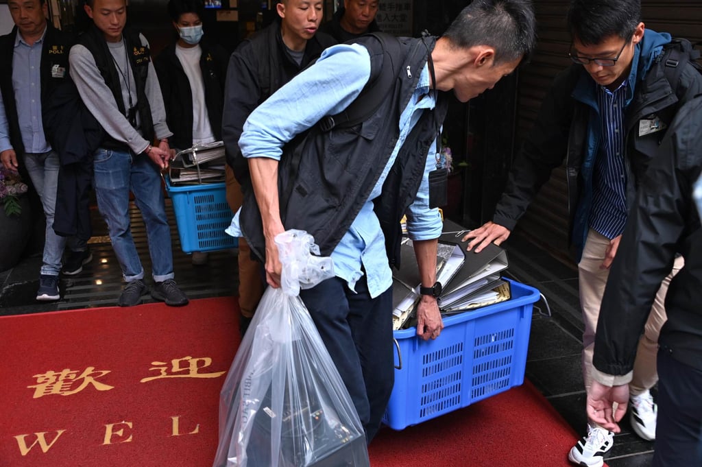 Police removed documents from the offices of Prestige Construction & Engineering Company. Photo: Handout