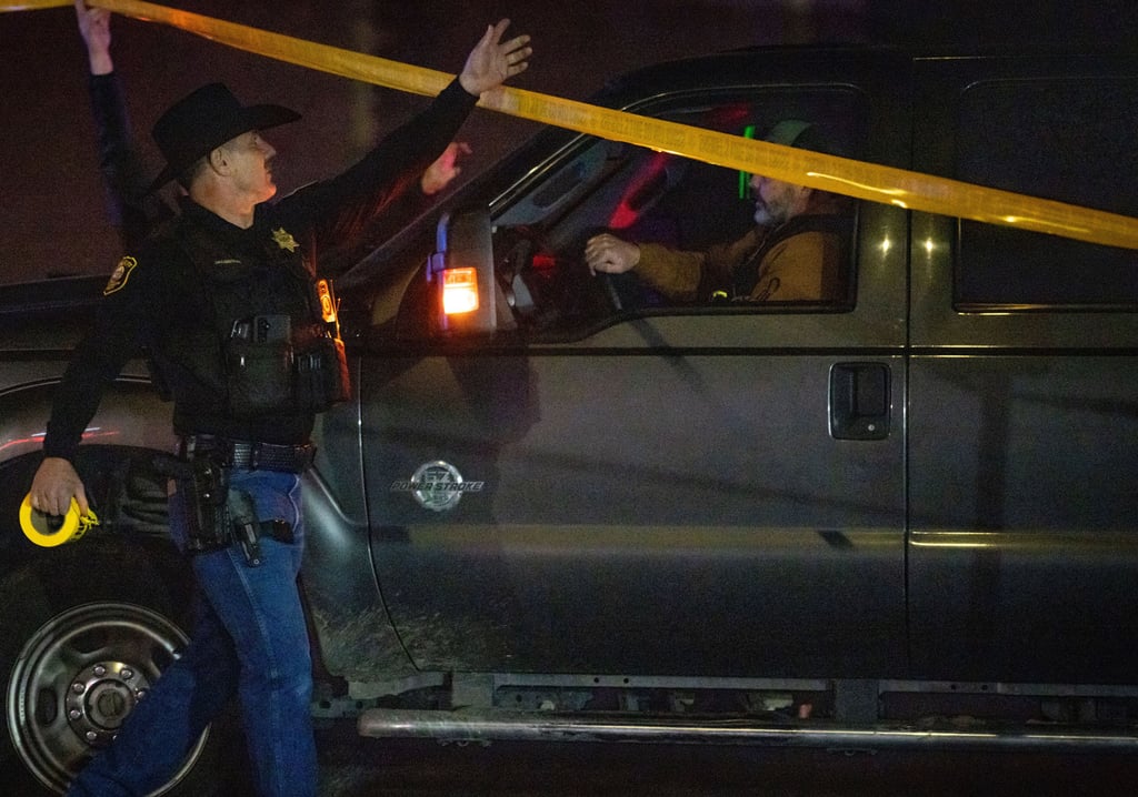 Investigators arrive at the scene of a mass shooting in Stockton on Saturday. Photo: AP