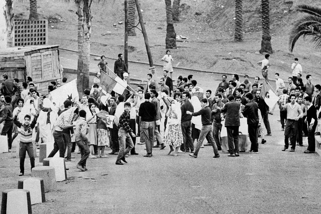 Young Muslims in a suburb of Algiers in 1961, ignoring French orders to stay at home. Photo: AP