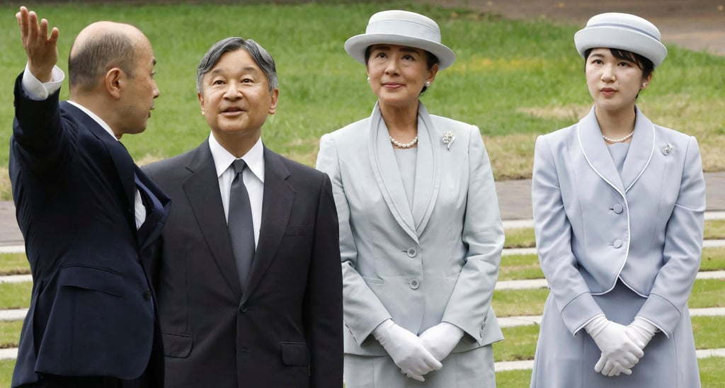 Japanese Emperor Naruhito, Empress Masako and Princess Aiko listen to Nagasaki Mayor Shiro Suzuki (left) as they visit a cenotaph for atomic bombing victims on September 12. Photo: Kyodo/AP