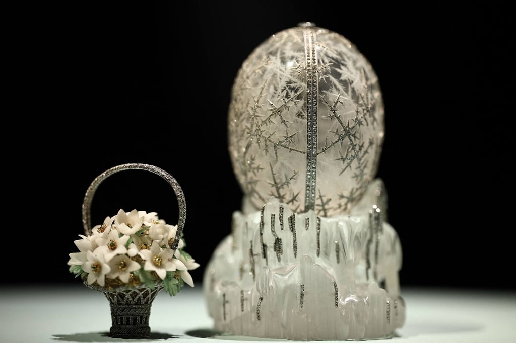 The Winter Egg by Faberge is covered in a snowflake motif and holds a tiny basket of quartz flowers. Photo: AFP