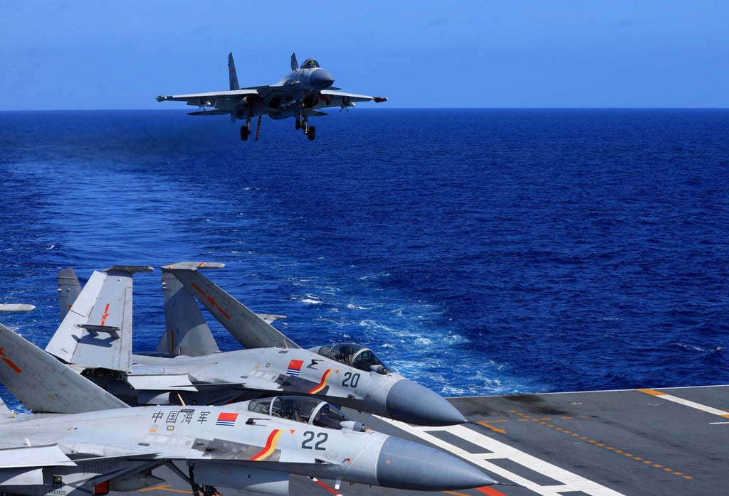 A Chinese J-15 fighter jet prepares to land on the Liaoning aircraft carrier in this photo released in December 2021. Tokyo says fighters like these locked on Japanese jets in a rare military encounter on Saturday. Photo: AP
