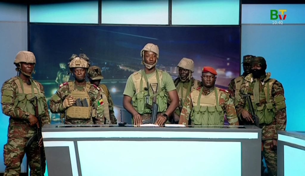 Soldiers who stormed the national television station on Sunday morning to announce the coup. Photo: Benin TV via AFP