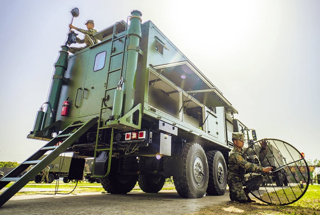 Soldiers with the Information Support Force, created in 2024, set up a network information system. Photo: PLA Daily