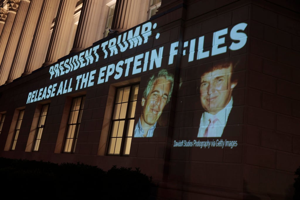An image of Donald Trump and Jeffrey Epstein, with the message “President Trump: Release All the Epstein Files” is projected onto the US Department of Commerce in Washington earlier this year. Photo: TNS