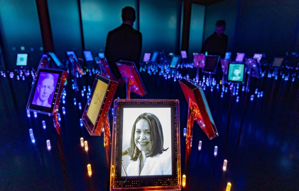 A picture of Nobel Peace Prize laureate Maria Corina Machado is seen among portraits of previous winners in Oslo on Tuesday. Photo: AFP