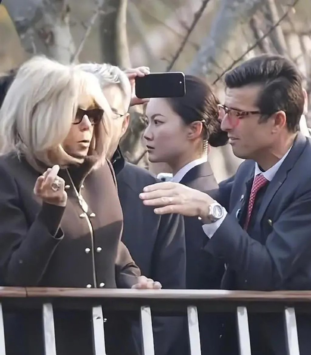 While Brigitte Macron, left, attended public events in Beijing and Chengdu, Yan, middle, was captured on film maintaining an alert demeanour, her eyes continually scanning the surroundings for potential threats. Photo: Weibo