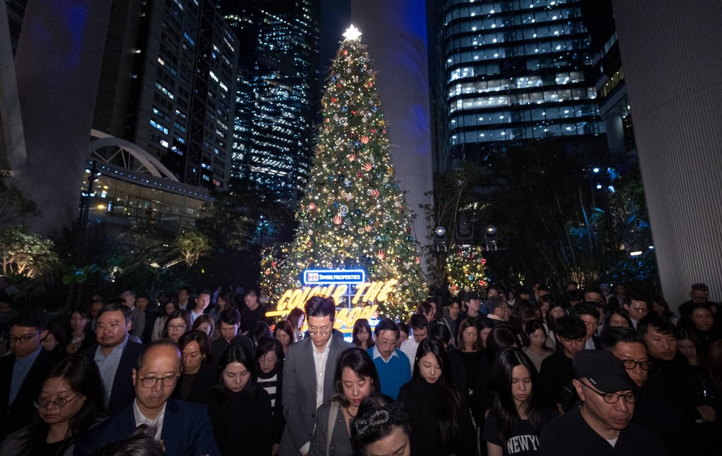 A moment of silence is observed for the victims of the Tai Po fire. Photo: Dickson Lee