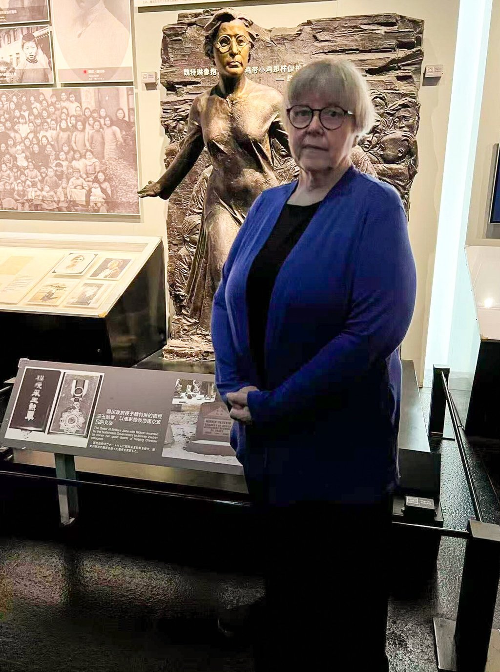 Elyn MacInnis stands before a statue of Minnie Vautrin, who was an American missionary during the Nanking massacre of 1937. Photo: Handout