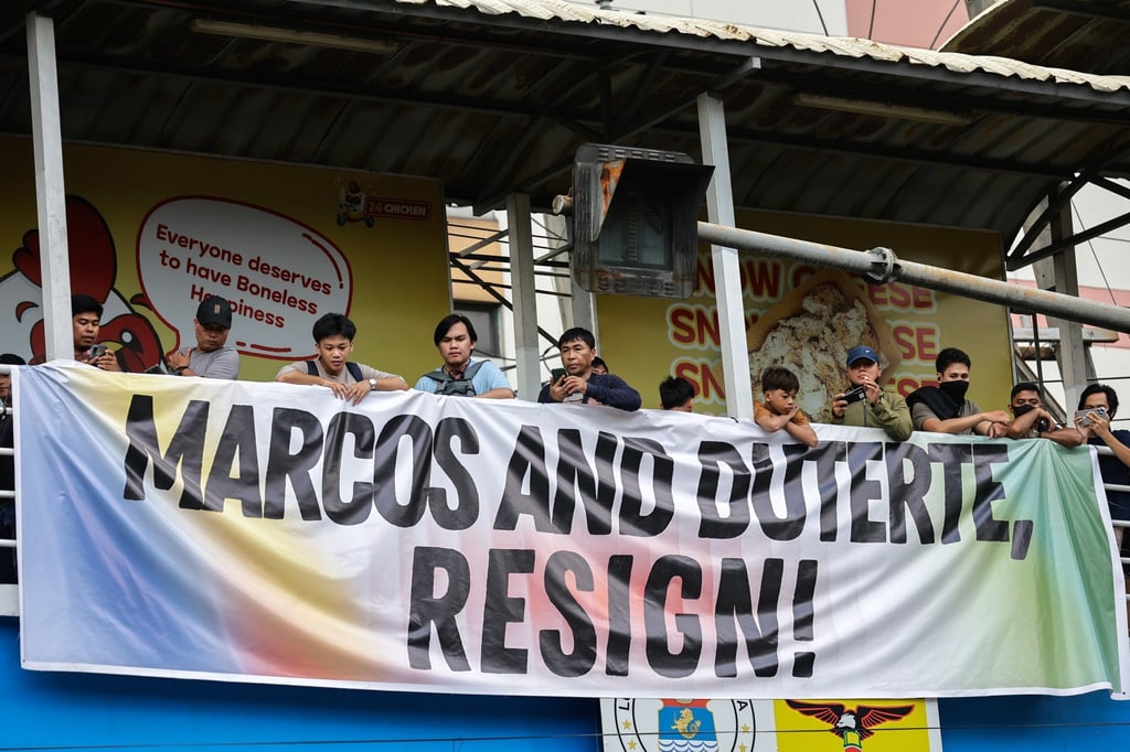 A banner calling for the resignation of Philippine President Ferdinand Marcos Jnr and Vice-President Sara Duterte hangs on a crossing bridge in Manila last month. Photo: EPA