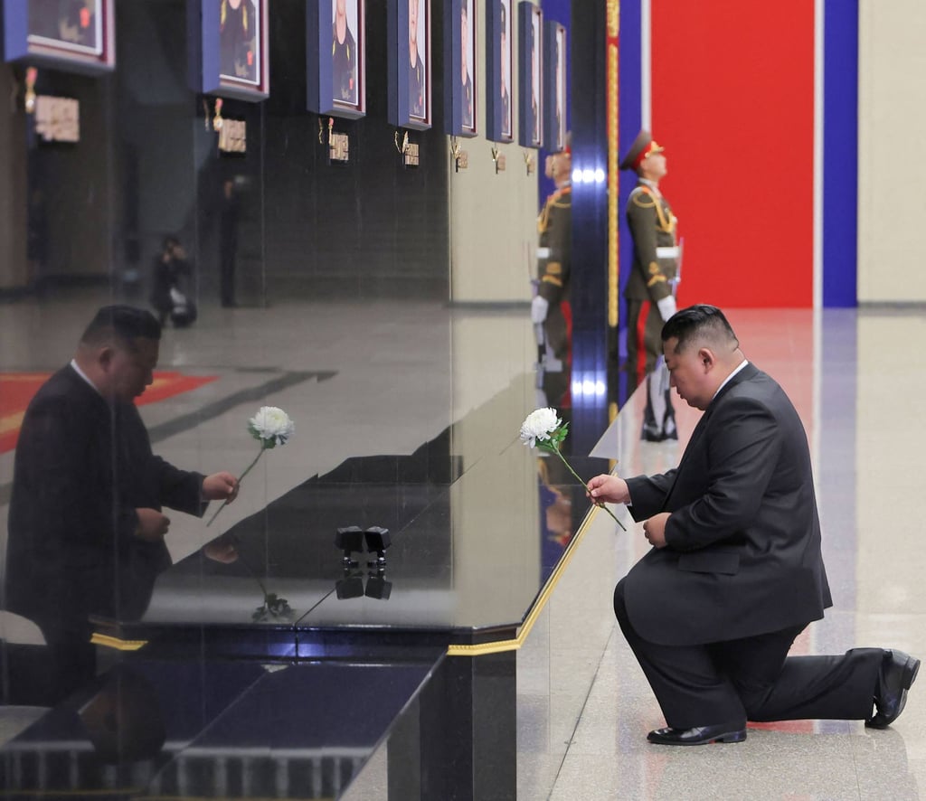 Kim Jong-un pays his respects in front of portraits of North Korean soldiers killed during their overseas deployment in Russia’s Kursk region on Friday. Photo: KCNA/AFP