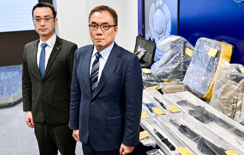 Superintendent Chow Hok-yin (left) and Chief Superintendent Steve Li with weapons seized last week. Photo: Handout