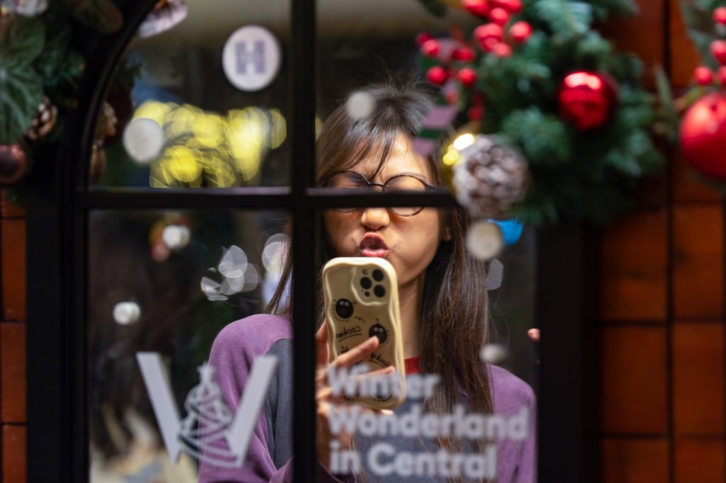 A woman visits the Christmas Town display in Central. Photo: Eugene Lee