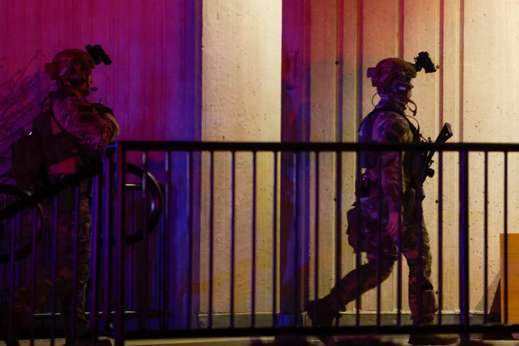 Swat team members at the scene. Photo: The Sun Chronicle via AP
