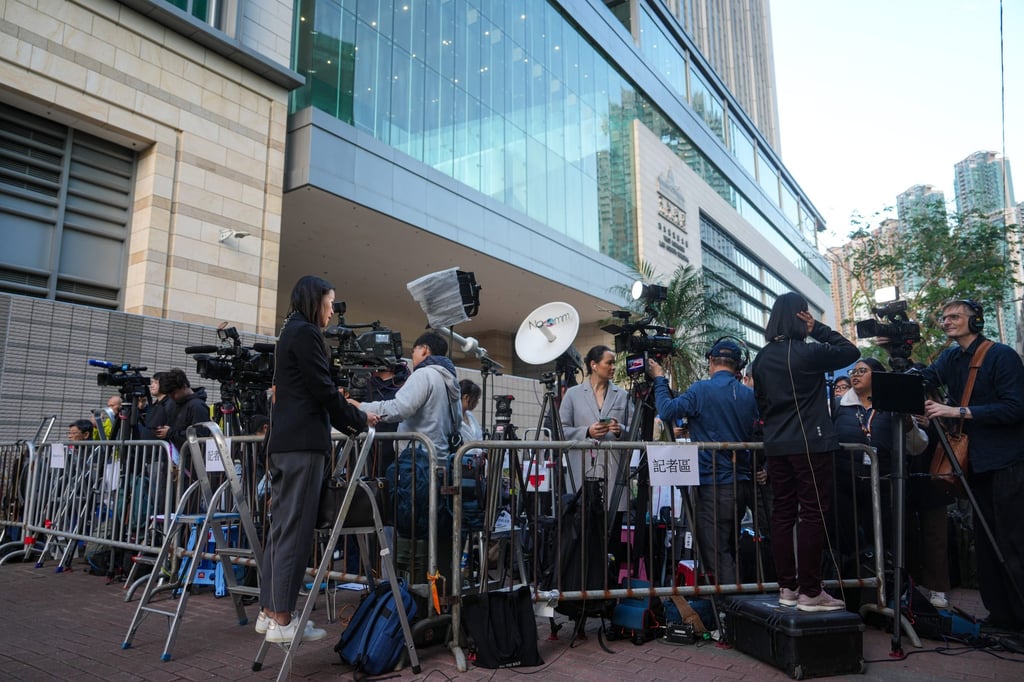 Media representatives gather outside West Kowloon Court on Monday, ahead of the hearing announcing the verdict on Jimmy Lai. Photo: Sam Tsang