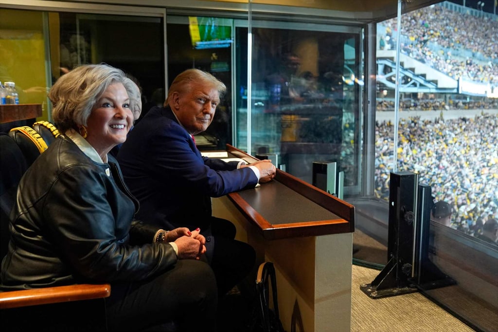 Republican nominee Donald Trump (right) attends an NFL game in Pittsburgh with senior campaign consultant Susie Wiles in October 2024. Photo: AFP