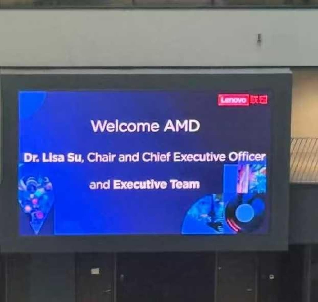 “Welcome AMD” displayed on multiple electronic screens at Lenovo headquarters in Beijing on Tuesday. Photo: Sina