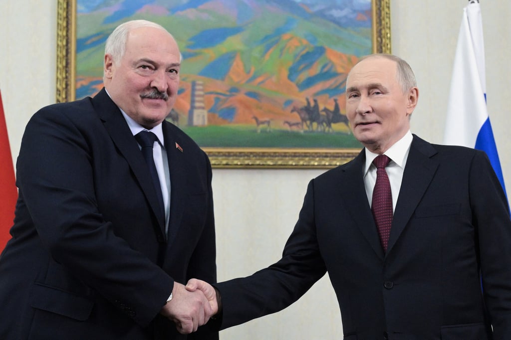 Belarusian President Alexander Lukashenko (left) shakes hands with Russian President Vladimir Putin in Bishkek, Kyrgyzstan, in November. Photo: Sputnik via AP