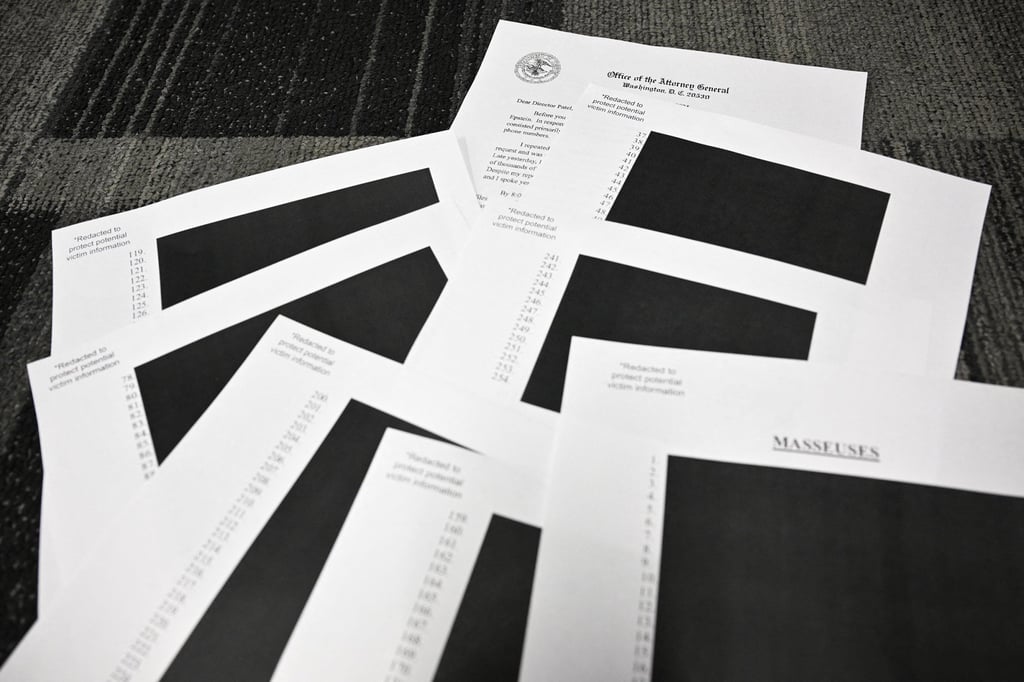 Redacted Epstein-related documents are seen after the US Justice Department began releasing the files on Friday. Photo: AFP/TNS