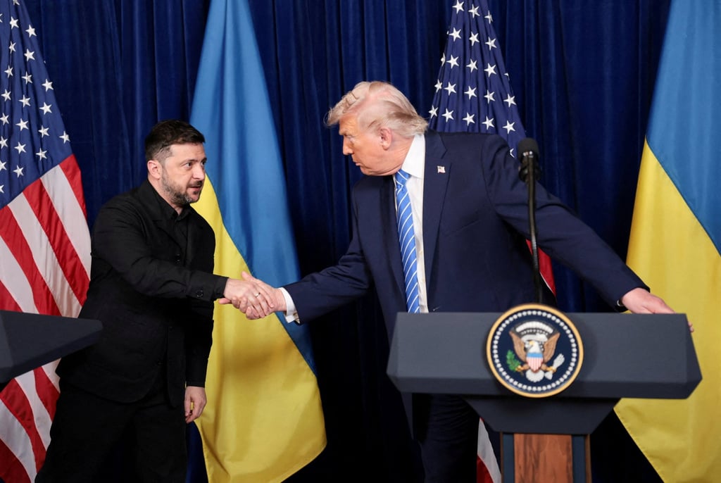 US President Donald Trump (right) and Ukrainian President Volodymyr Zelensky shake hands during a press conference at Trump’s Mar-a-Lago club, in Palm Beach, Florida on Sunday. Photo: Reuters