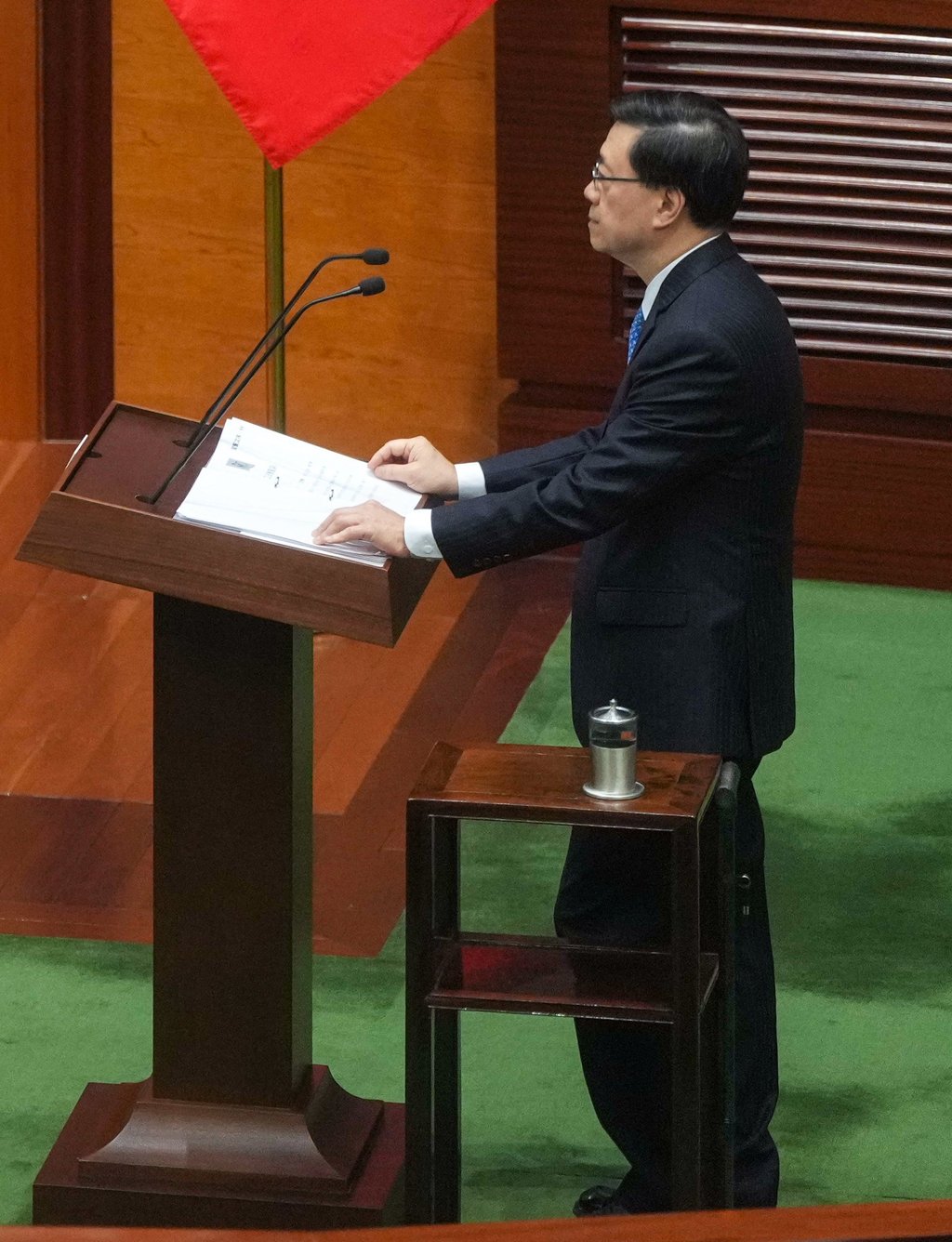 A cane is placed next to John Lee during the ceremony. Photo: Sam Tsang