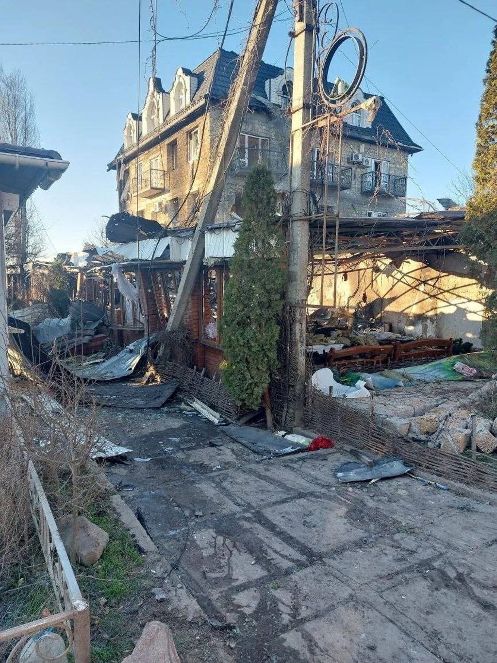Debris lies on the ground near a destroyed building in the village of Khorly on Thursday. Photo: Governor of Kherson Region Vladimir Saldo via Telegram/Reuters