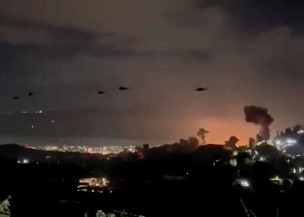 US helicopters flying over Caracas on January 3. Photo: Reuters