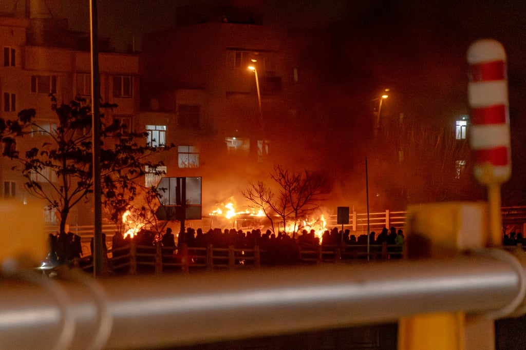 Iranians block a street during a protest in Tehran on Friday. Photo: AFP