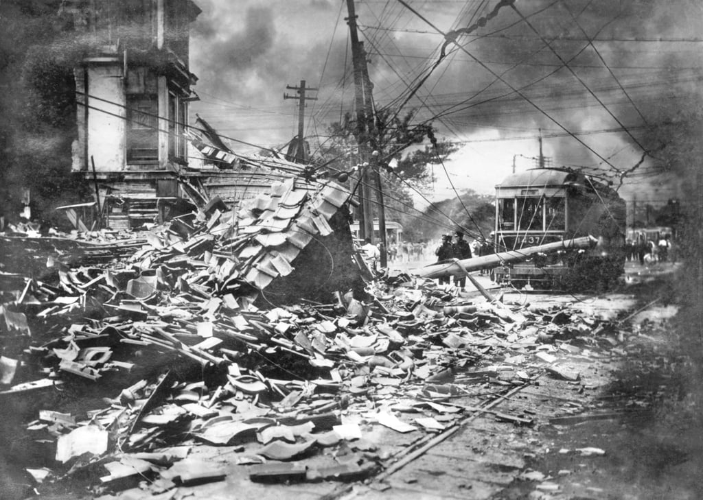 Smoke rises over damaged buildings in Tokyo after the Great Kanto Earthquake of 1923. Photo: Kyodo News/AP