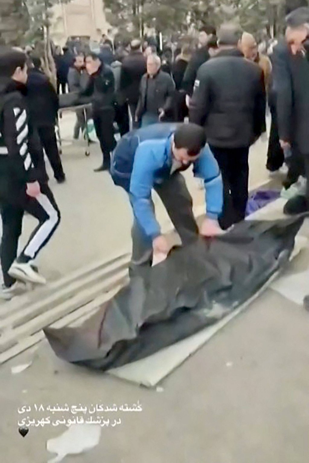 A body wrapped in a black bag outside the Kahrizak Forensic Medical Centre in Tehran. Photo: UGC via AFP