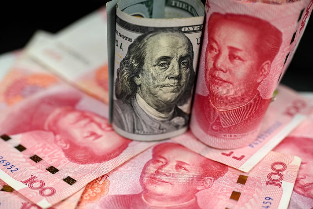 This photo illustration shows Chinese yuan and US dollar notes in Beijing on April 8, 2025. Photo: AFP