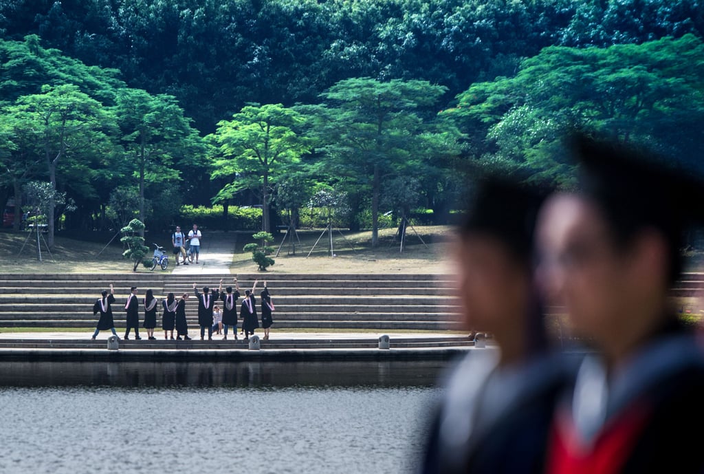 Graduates pose for photos at Xiamen University in June 2014. The French professor was reportedly a regular visitor at the school. Photo: Xinhua