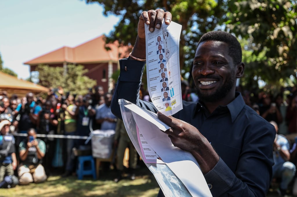 Uganda’s opposition leader Robert Kyagulanyi, popularly known as Bobi Wine, shows a ballot paper before voting in the presidential election in Kampala on Thursday. Photo: EPA