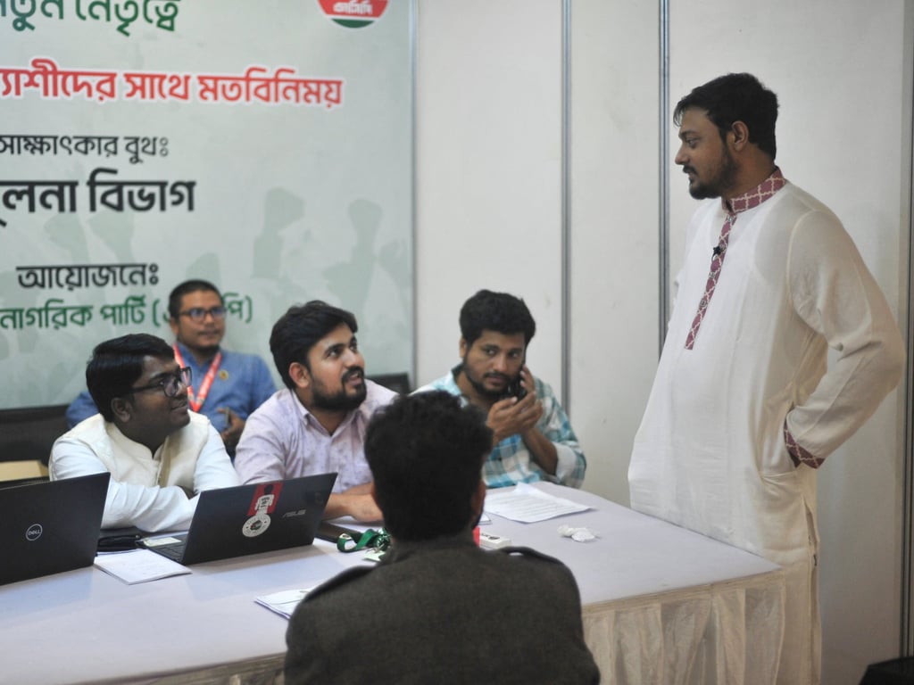 Leaders of the National Citizen Party chat during an event in Dhaka, Bangladesh, in November. The party will contest only 30 seats in the February 12 election. Photo: Reuters
